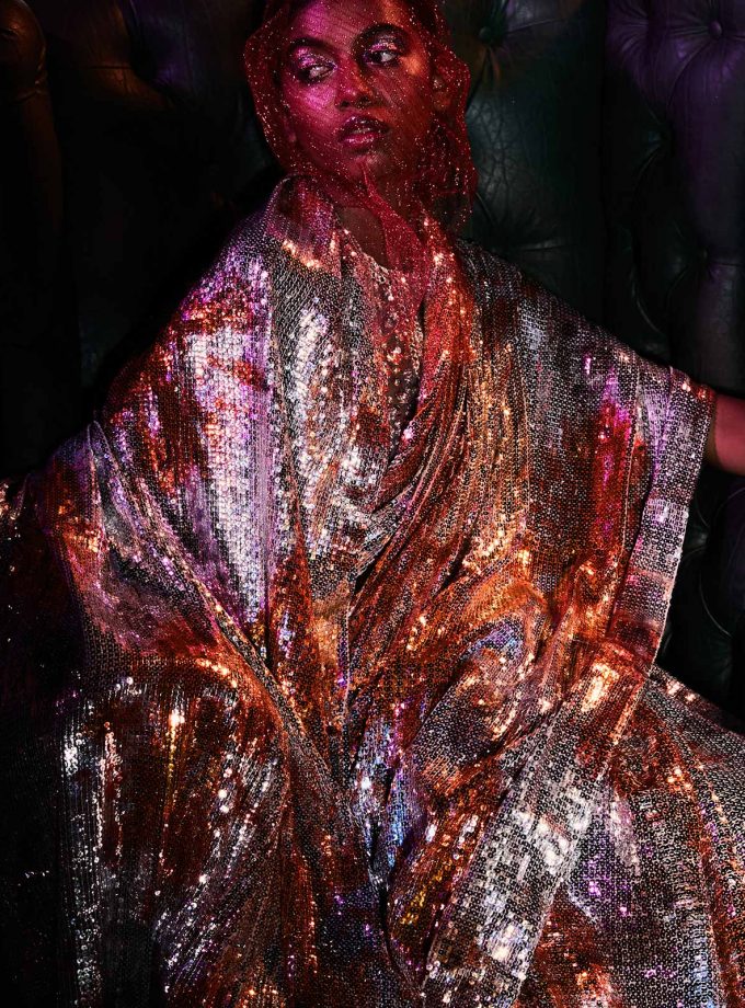 Silver sequin sheeted sari with texture printing on sequin in Orange